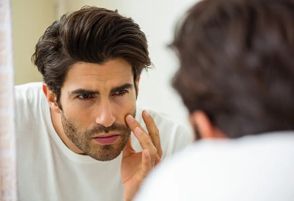 False facts about beard and moustache transplantation - man looking at beard 1 - 1
